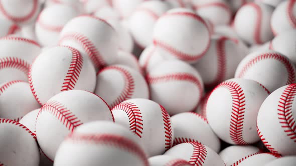 A large number of white baseball balls. Set of many professional sports balls. alt