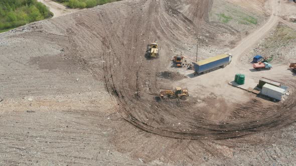 Waste Management Plant. Landfill with the sorting trucks alt