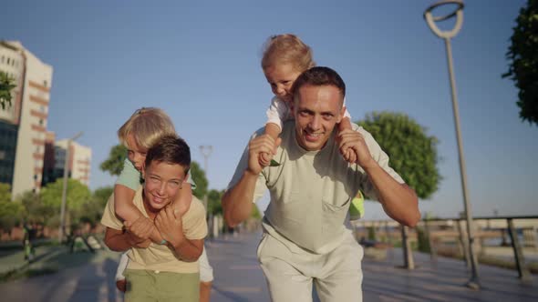 Father Play with Little Children Outdoor alt