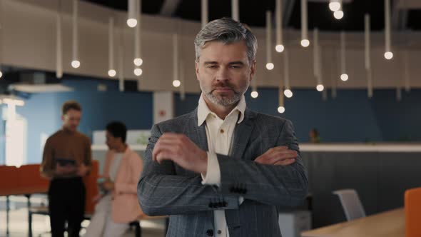 Confident Chief Executive in Suit Looking at the Camera and Smiling