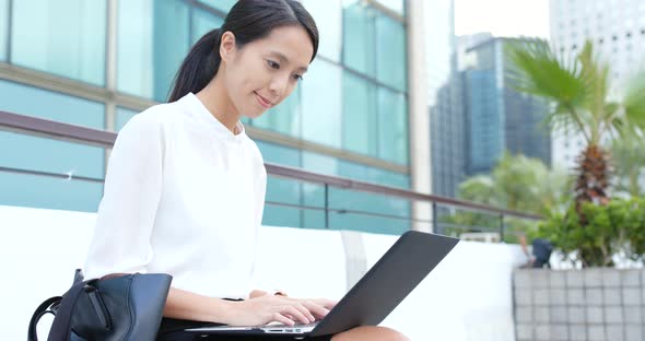 Businesswoman use of laptop computer at outdoor alt