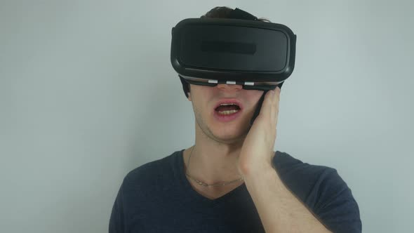 Man In A Helmet Of Virtual Reality Speaks On The Phone