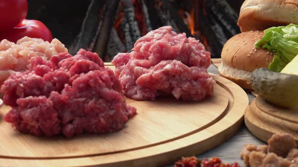 Closeup of the Raw Ingredients for Burgers Chicken Beef and Pork Minced Meat alt