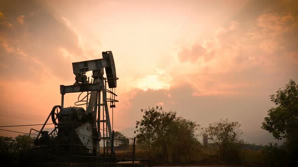 old pumpjack pumping crude oil from oil well, timelapse