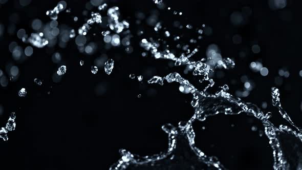 Super Slow Motion Shot of Water Splashing on Black Background at 1000Fps alt