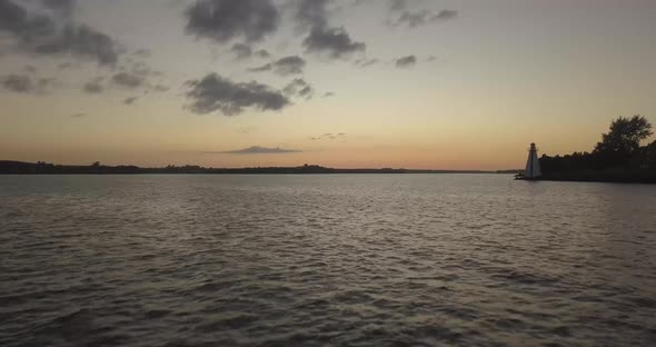 Drone shot going away from lighthouse alt