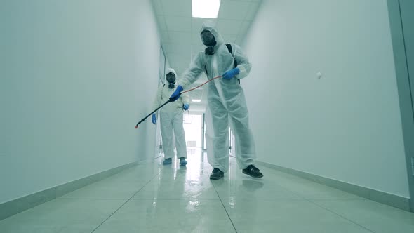 White Corridor Is Getting Chemically Sanitized By the Specialists alt