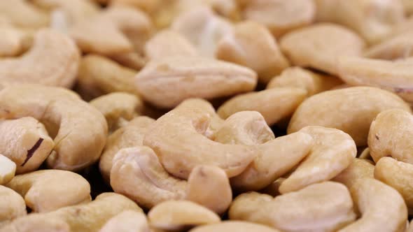 Cashew nuts rotating close up. Abstract background of organic ecological cashew nuts.