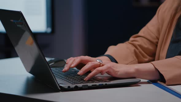 Closeup of Businesswoman Hands on Keyboard Sitting at Desk in Startup Company Office alt