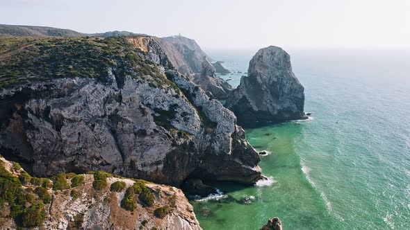 Aerial Footage of Rocky Coastline Near Praia Da Ursa Beach and Cabo Da Roca Located on Atlantic alt