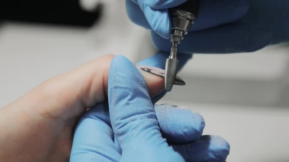 Manicurist Master Is Removing Gel Polish From Woman's Nails Hardware Manicure