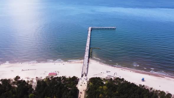 Pedestrian bridge leading into Baltic sea in Palanga, aerial view alt