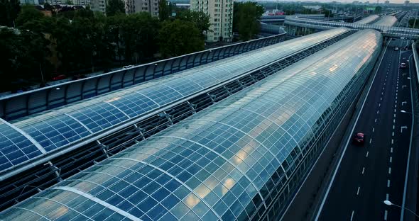 Drone view on a modern glass tunnel construction over the highway in Warsaw. alt