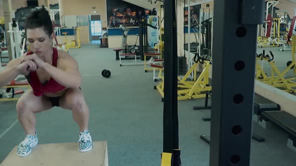 Young Girl Athletic Builds Her Leg Muscles Performing Jumps on the Curb alt