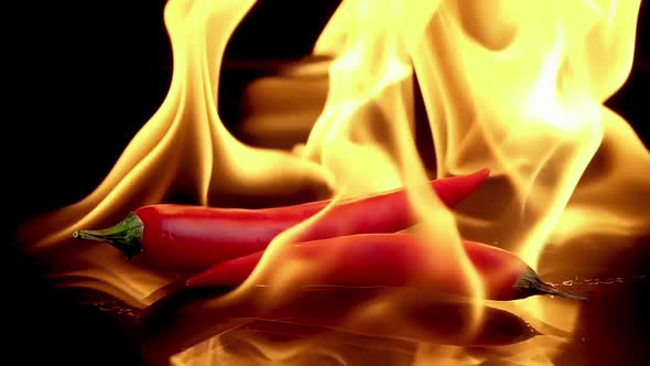 Hot Red Chili Peppers in Flames Burn alt