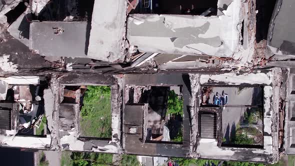 Vertical Video of Civilian Cars Destroyed During the War in Ukraine alt