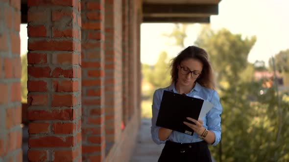 Designer On Construction Site. Builder Contractor Specialist Read Plan Scheme. Civil Engineer. alt