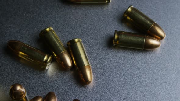 Cinematic rotating shot of bullets on a metallic surface - BULLETS 047 alt