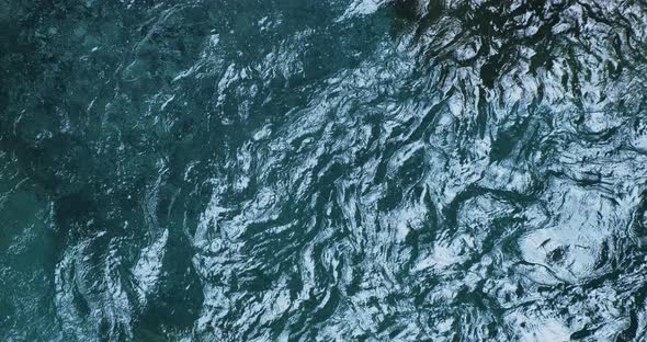 Closeup Turquoise Fresh Water of Mountain River Top View alt
