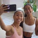 Female Athletes Posing and Taking Selfie Photo During Fitness Training at Home Interior - VideoHive Item for Sale