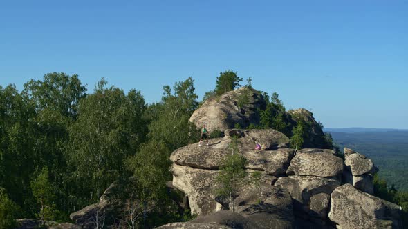 the Girl Does Yoga and Fitness in Nature