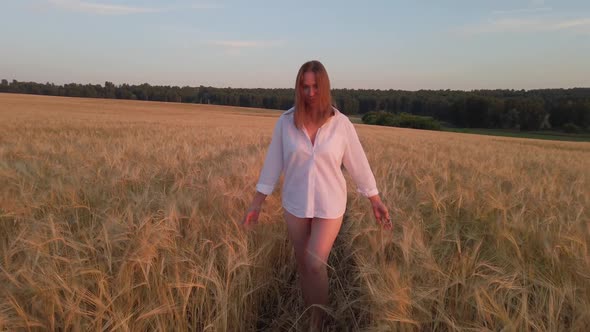 Woman in the Yellow Field of Wheat