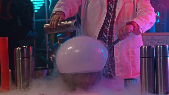 Scientist Pours the Liquid Nitrogen on the Balloon - Show of Amazing Chemical Reactions alt