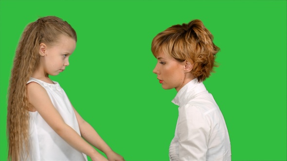 Mother speaks with her daughter on a Green Screen, Chroma Key