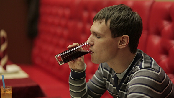 Young Man on a Date Drinking Juice