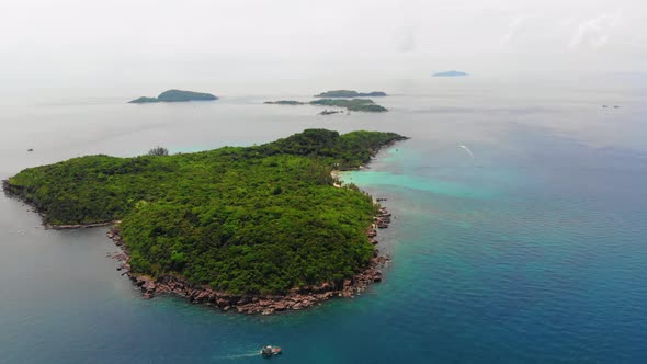 Aerial High Altitude View of Beautiful Wild Green Tropical island, Phu Quoc Vietnam, Rocky Coast, Cl alt