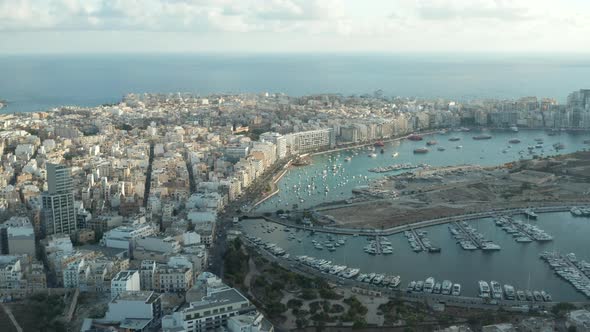 Bay on Malta Island with Yachts and Sailboats, Aerial Wide Establishing Shot alt