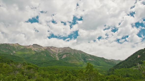 Mountain time-lapse with clouds. alt