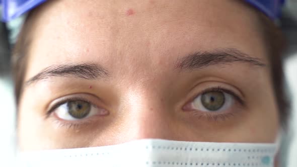 Tired Doctor Woman During a Pandemic COVID-19 alt