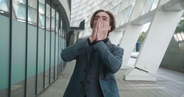 Excited Businessman Rejoices at Victory Clenches His Fists Shows Yes alt