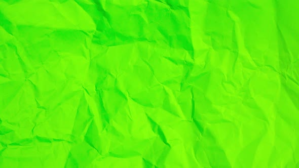 Stop Motion of Crumpled Neon Green Paper Background