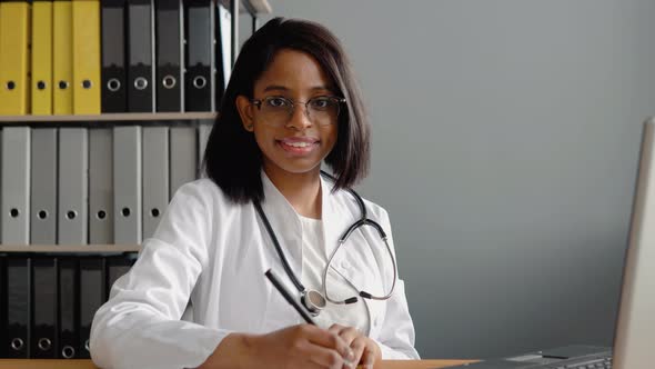 Portrait of Confident Skilled Practitioner Indian Female Physician in Eyeglasses alt