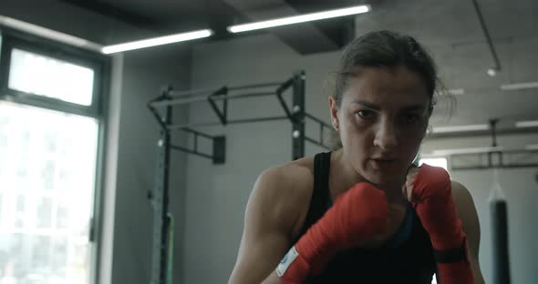 Mixed Martial Art Fighter Woman Does Shadow Boxing to the Camera in the Fight Club Female Fighter is