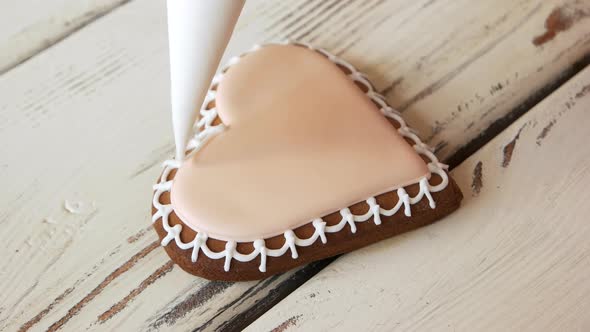 Decoration of Biscuit Cookie with White Frosting alt