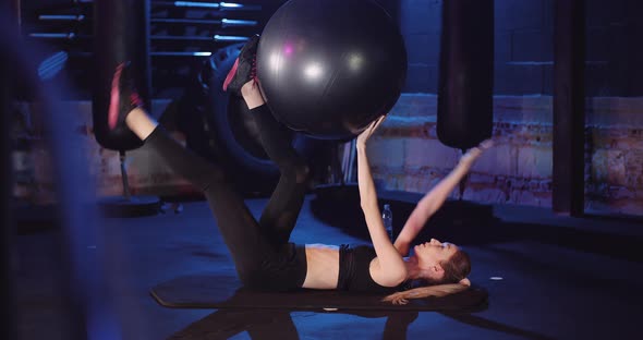 Slim Female Athlete Doing Pilates Workout At Gym alt