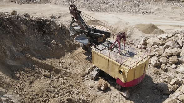 Heavy Equipment Loads Limestone Into The Machine alt