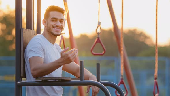 Confident Healthful Millennial Middle Eastern Arab Athletic Guy Invites you to Go in for Sports alt
