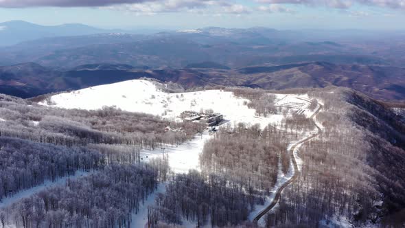 Aerial view at the mountain on a sunny winter day