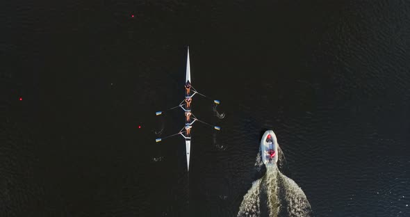 Sports Canoe Driven By Team Men Women Sailing Along Calm River with Sun alt