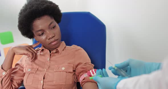 Female Lab Assistant Taking Venous Blood for Test alt