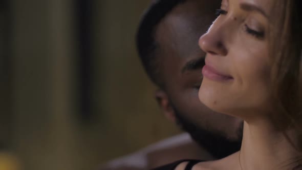 Closeup of Sensual Foreplay in Candlelit Bedroom alt