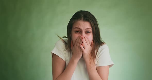 Despaired Upset Actress Closes Face with Palms in Studio alt