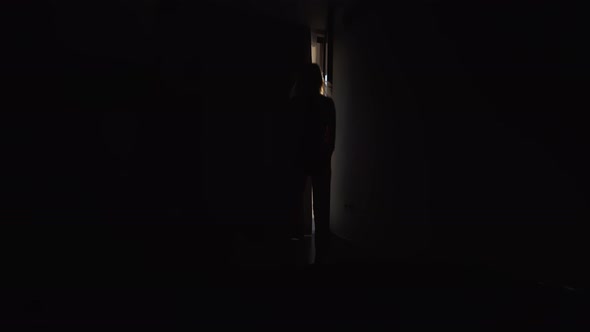 Woman in morning. Attractive sexy woman with slender body looks at sunrise, alt