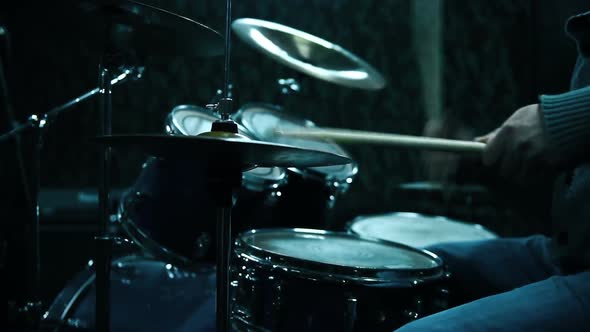 Drummer Playing On Drums.