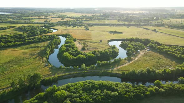 Countryside. A Wide Riverbed, Flowing Between Fields And Forests