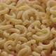 Macaroni Pieces Being Added To Heap Of Dried Pasta - VideoHive Item for Sale